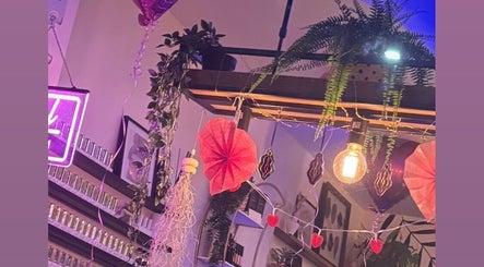 Stylish interior at Danie Beauty, Hillsborough, England, GB featuring vibrant decor and calming plants.