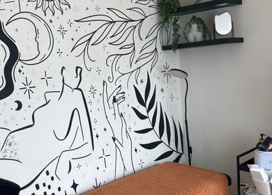 Artistic wall mural and cozy setting at Danie Beauty, Hillsborough, England, GB.