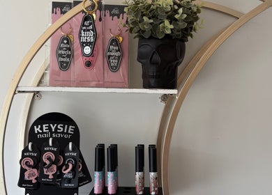 Chic shelf display at Danie Beauty, Hillsborough, England, GB showcasing nail accessories and decor.