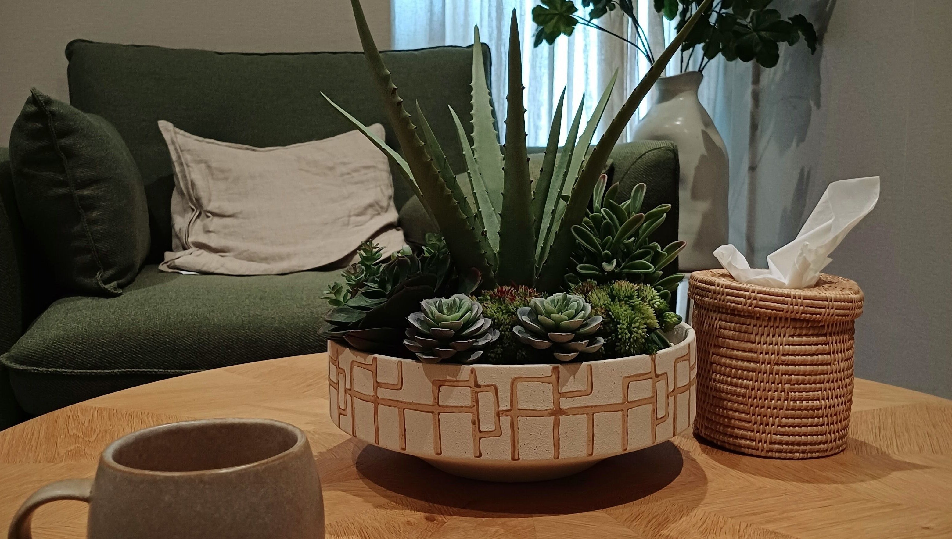 Cozy lounge with plants at Heal With Hollie, Wirral, England, GB showcasing relaxed ambiance.