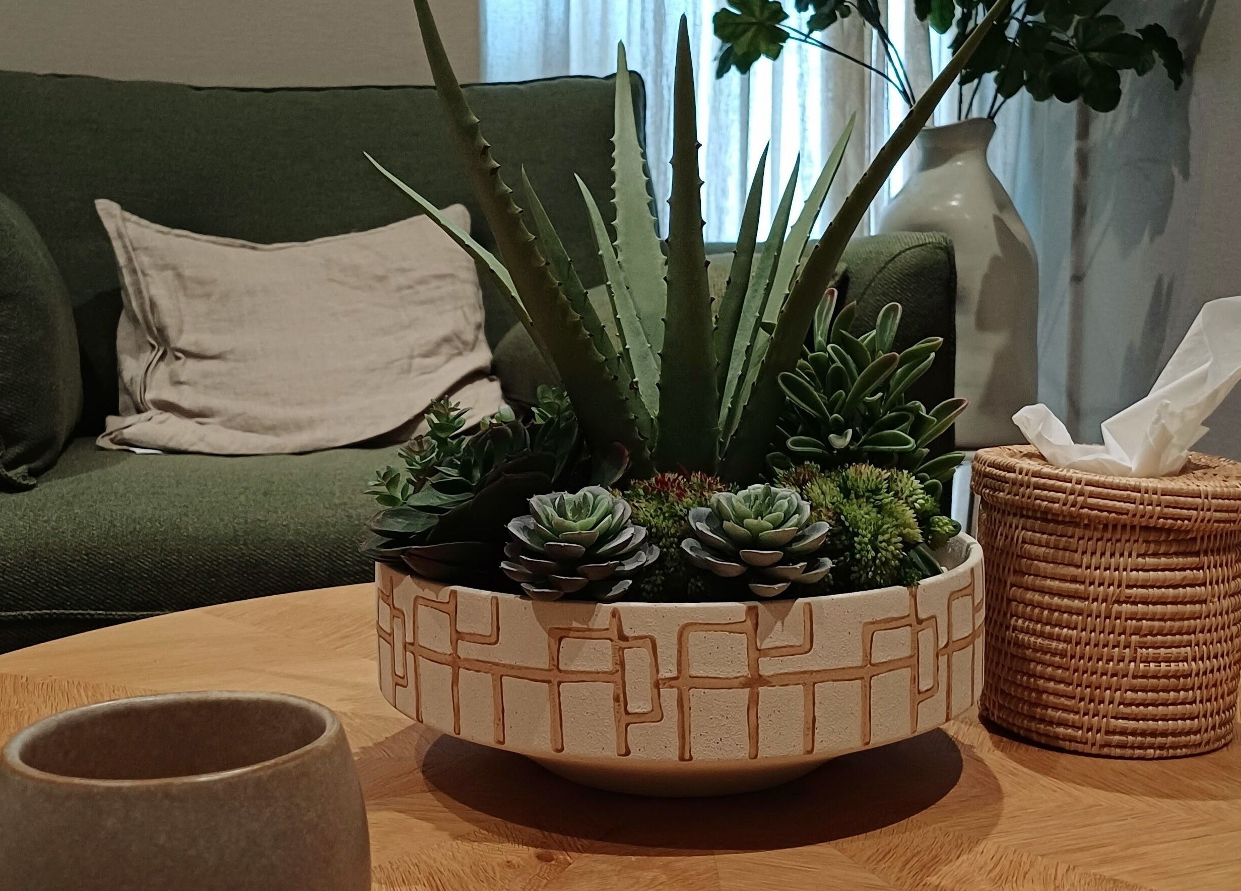 Cozy lounge with plants at Heal With Hollie, Wirral, England, GB showcasing relaxed ambiance.