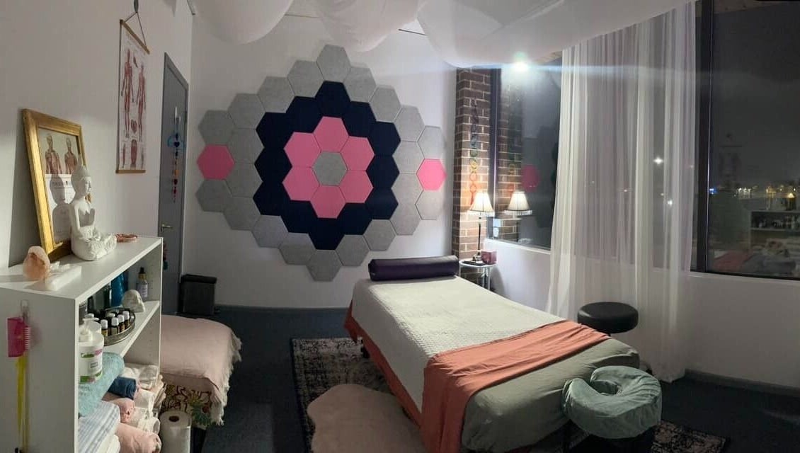 Cozy massage room at Mindful Body Studio in Hickory Hills, Illinois, US with soothing decor and soft lighting.