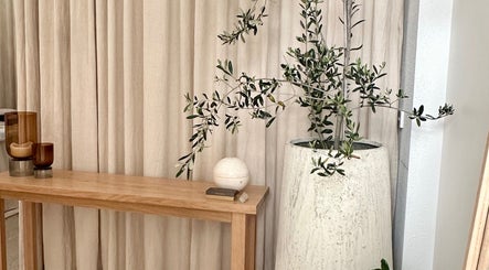 Peaceful corner at Aiyana Integrated Wellness, Toowoomba City, Queensland, AU with a plant and wooden decor.