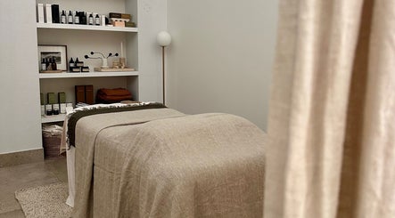 Calm therapy room at Aiyana Integrated Wellness, Toowoomba City, Queensland, AU with soft lighting and treatment bed.