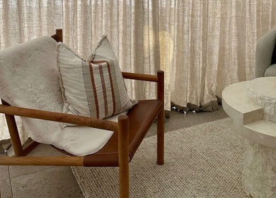 Comfortable seating in Aiyana Integrated Wellness, Toowoomba City, Queensland with plush chair and rustic table.