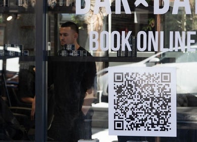 QR code and signage at BAR x BAR Bondi in Bondi Beach, New South Wales, AU, inviting online bookings.
