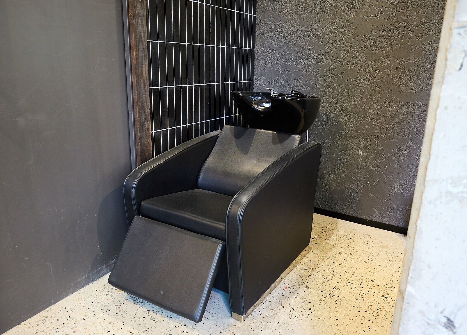 Comfortable salon rinse station at BAR x BAR Manly, located in Manly, New South Wales, AU.