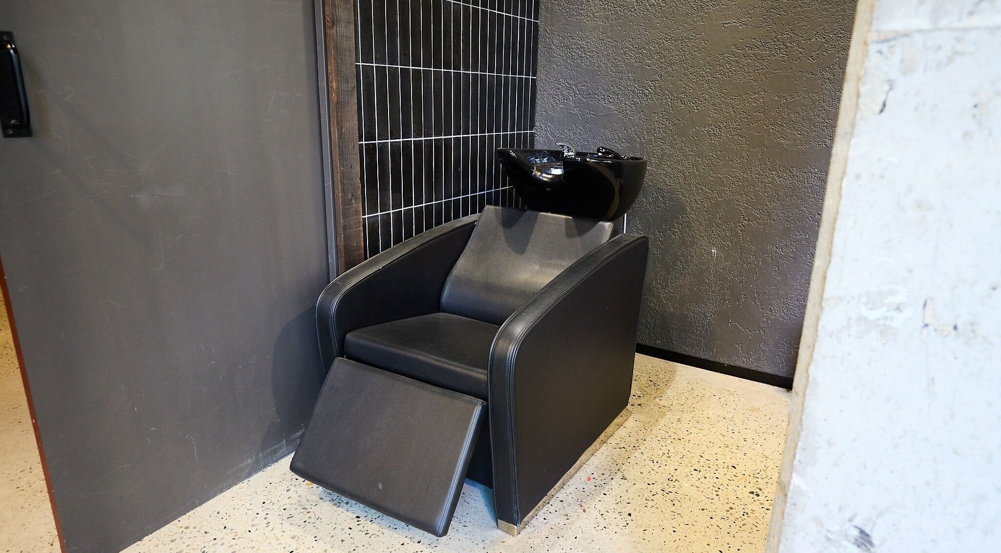 Comfortable salon rinse station at BAR x BAR Manly, located in Manly, New South Wales, AU.