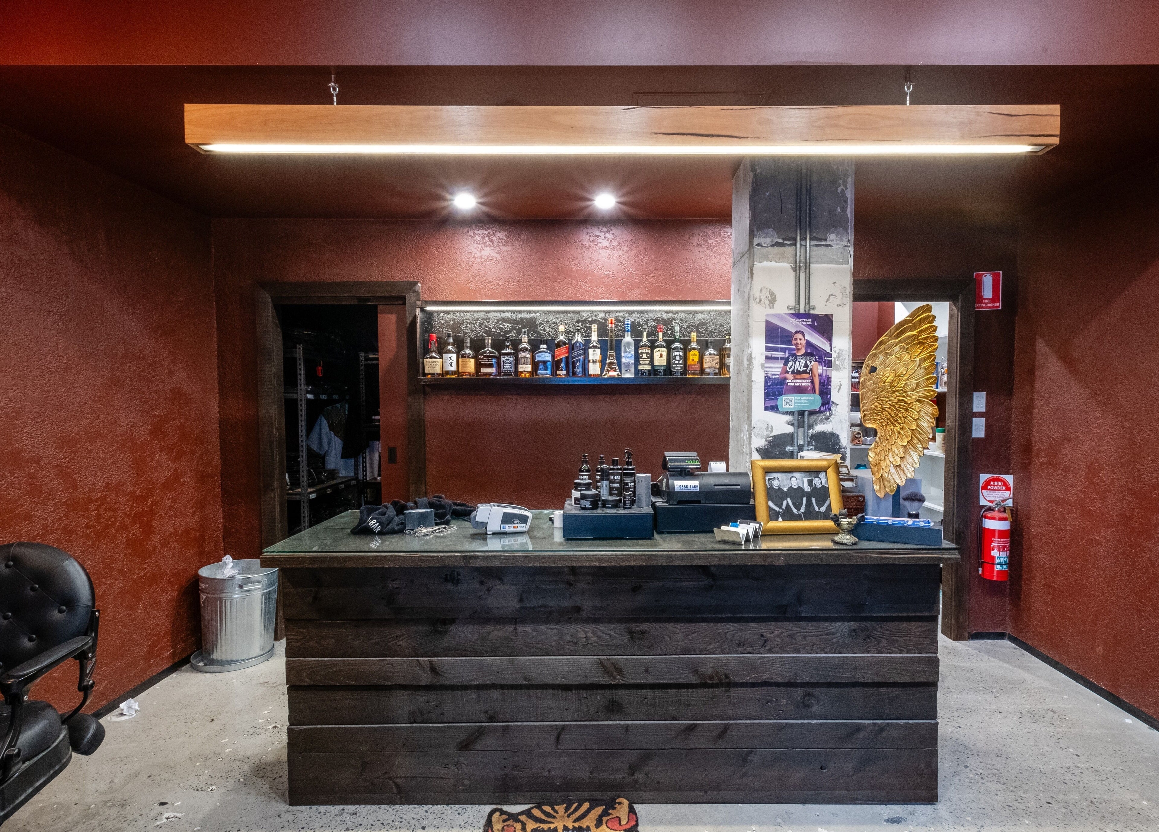 Stylish counter at BAR x BAR Manly, showcasing decor and display of spirits in Manly, New South Wales, AU.