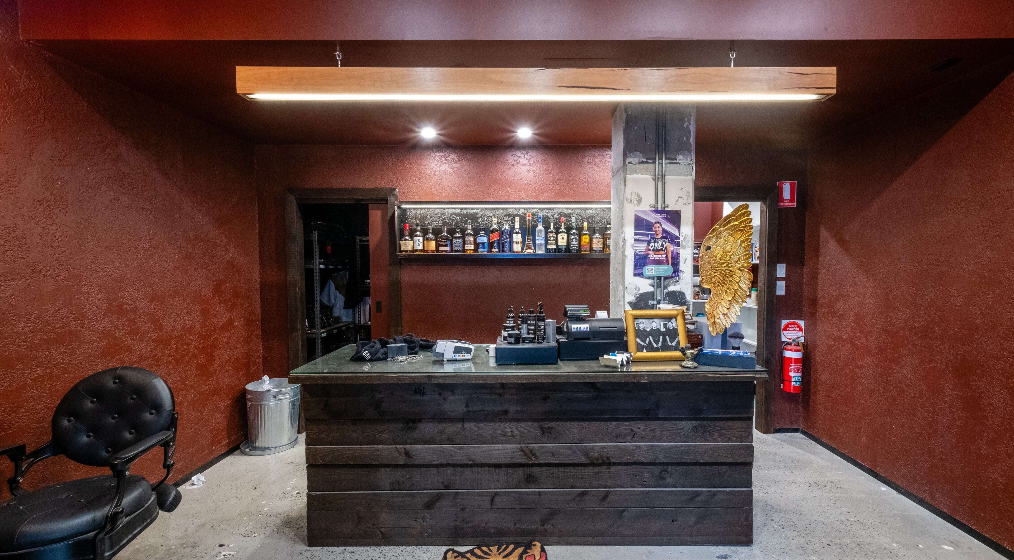 Stylish counter at BAR x BAR Manly, showcasing decor and display of spirits in Manly, New South Wales, AU.