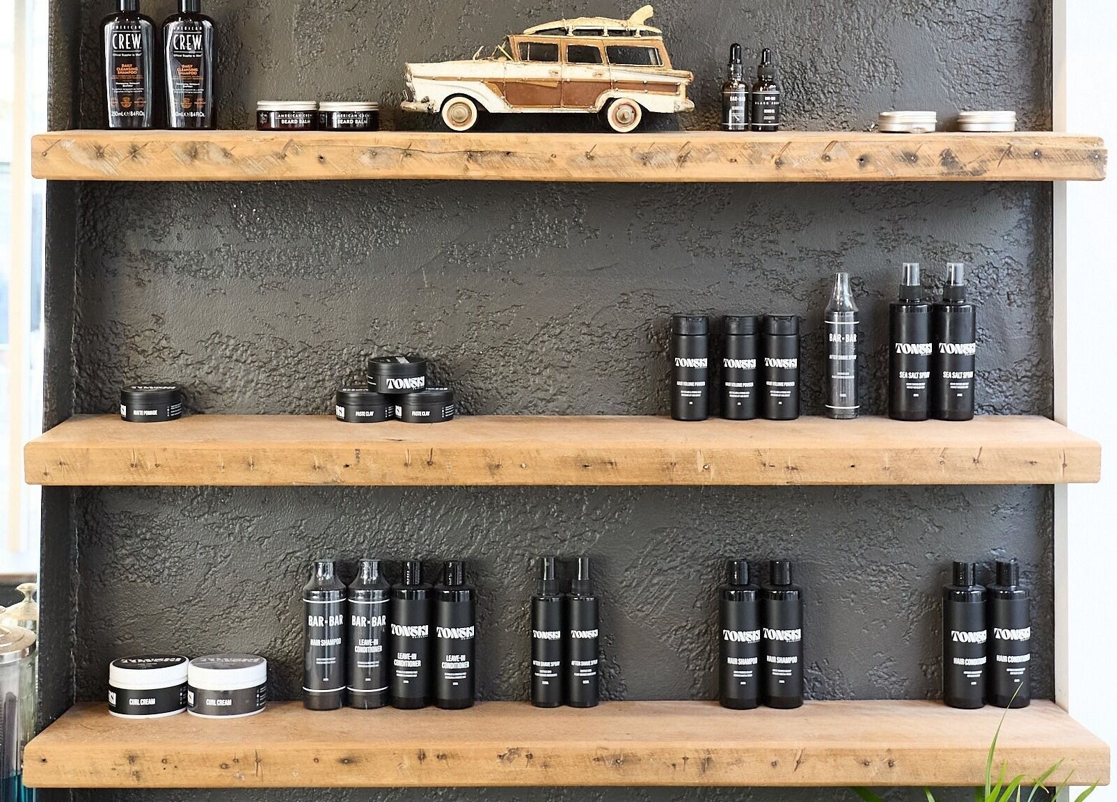 Stylish product shelf at BAR x BAR Manly, Manly, New South Wales, AU, showcasing grooming essentials.