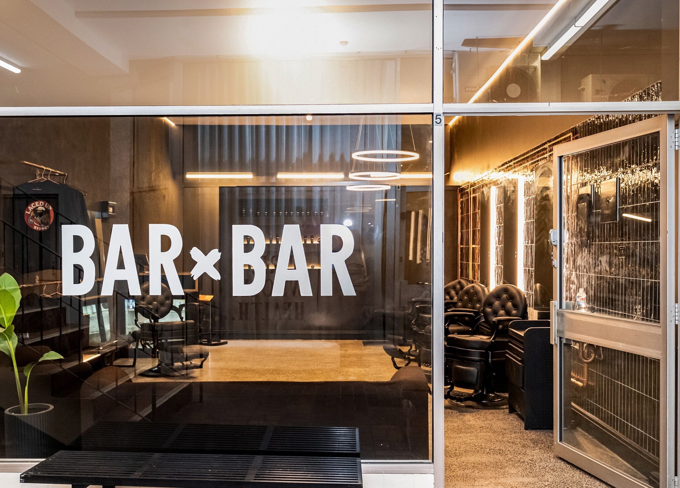 Entrance of BAR X BAR Freshwater in Freshwater, New South Wales, AU showcasing stylish interior lighting.