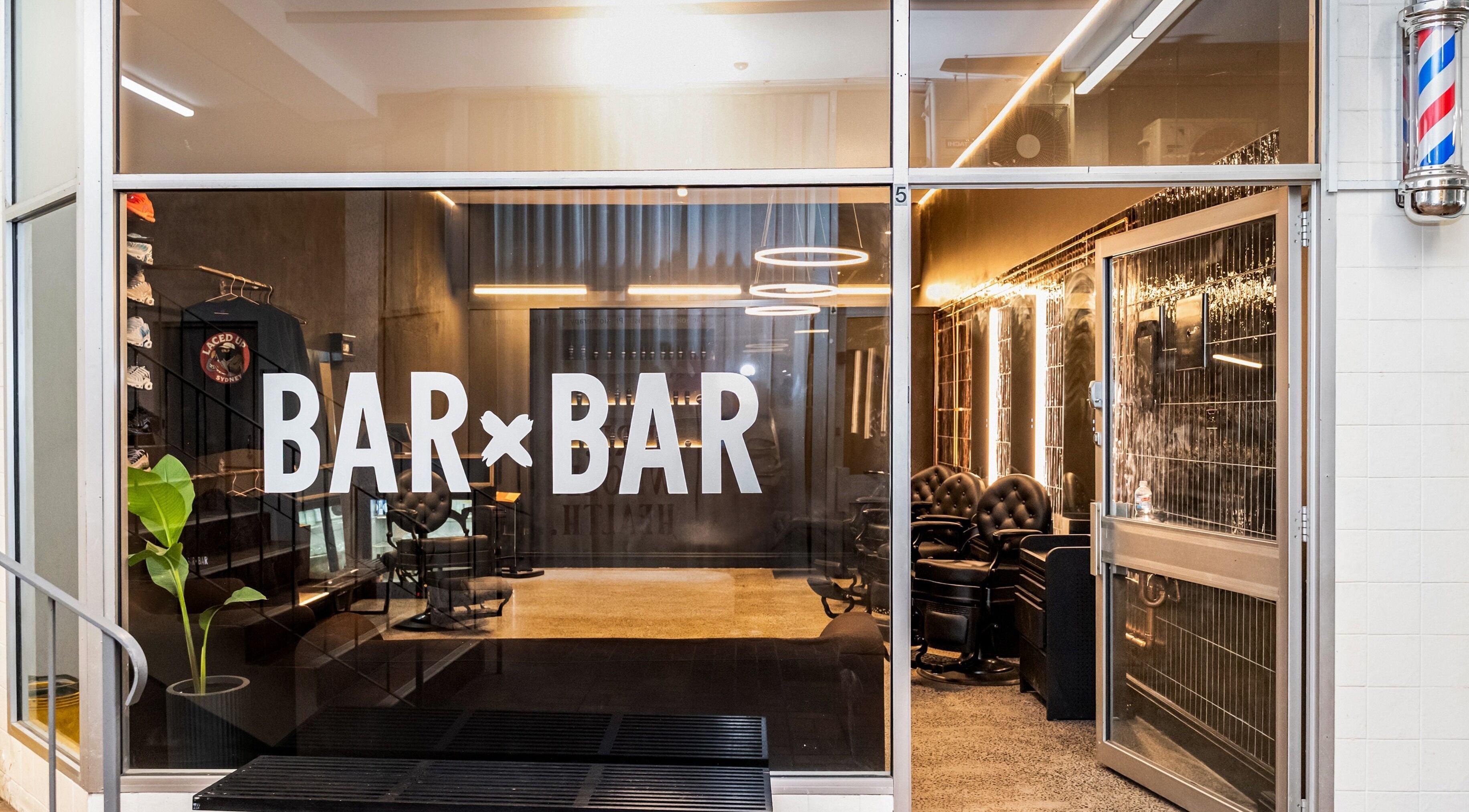 Entrance of BAR X BAR Freshwater in Freshwater, New South Wales, AU showcasing stylish interior lighting.