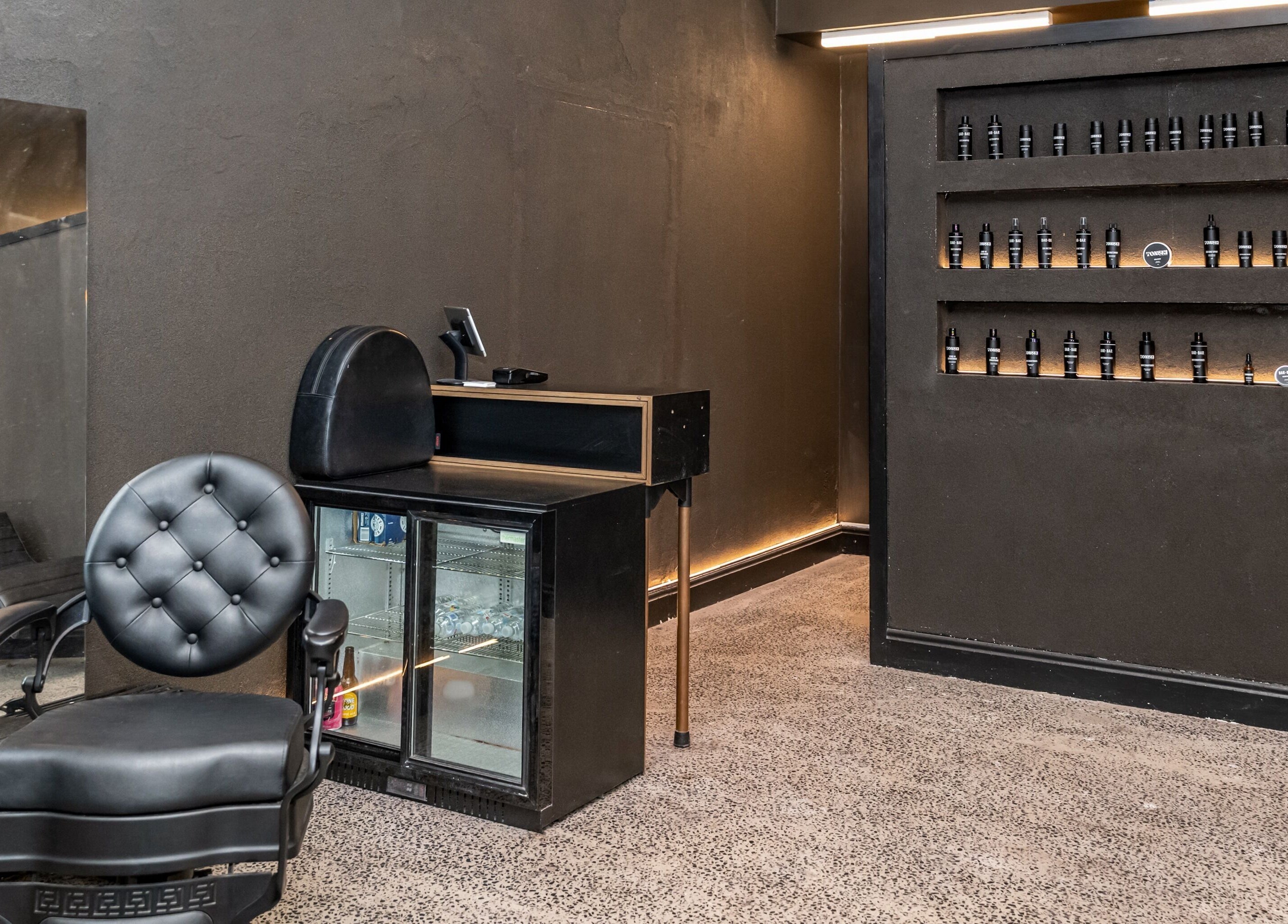 Elegant salon chair and product display at BAR X BAR Freshwater, Freshwater, New South Wales, AU.