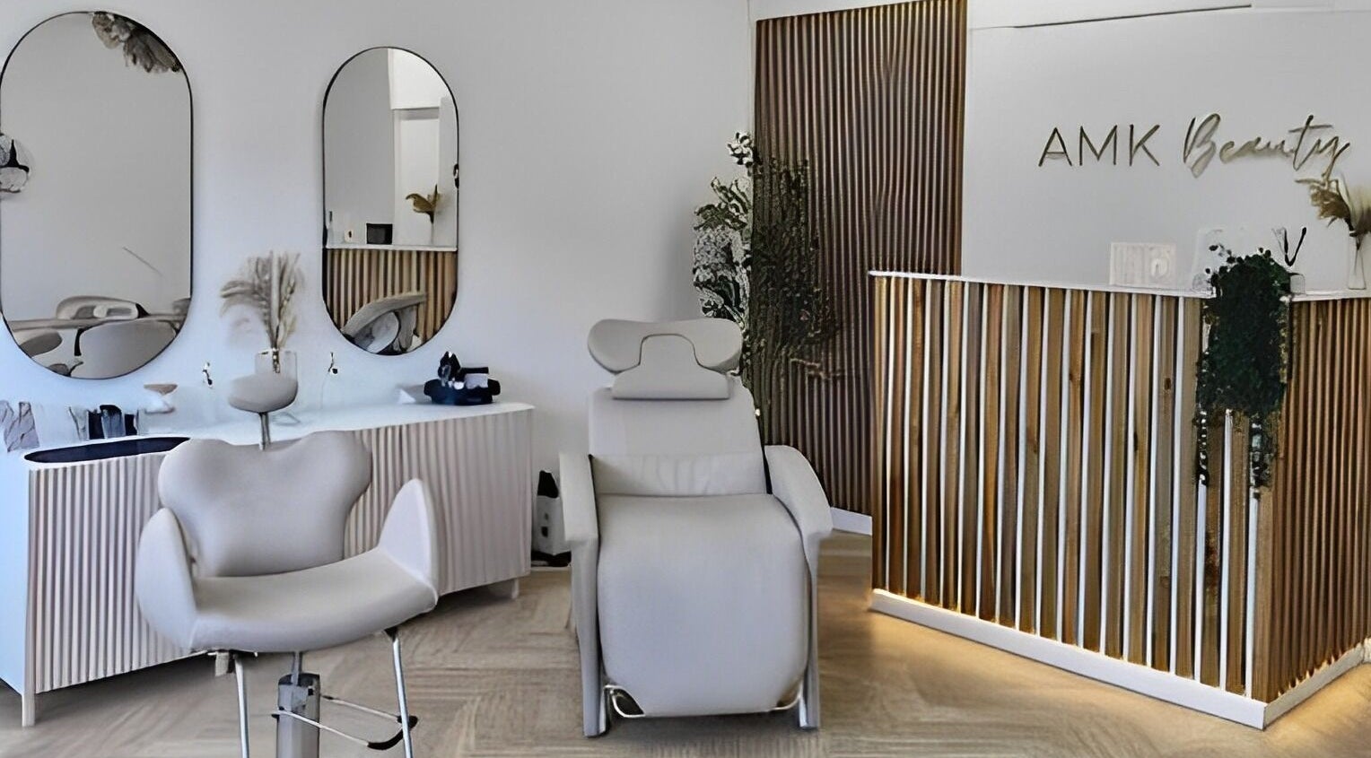 Chic interior of AMK Beauty in Bath, England, GB showcasing modern decor and a luxurious treatment chair.