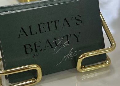 Business cards in a gold holder at Aleita’s Beauty, Kilmarnock, Scotland, GB.