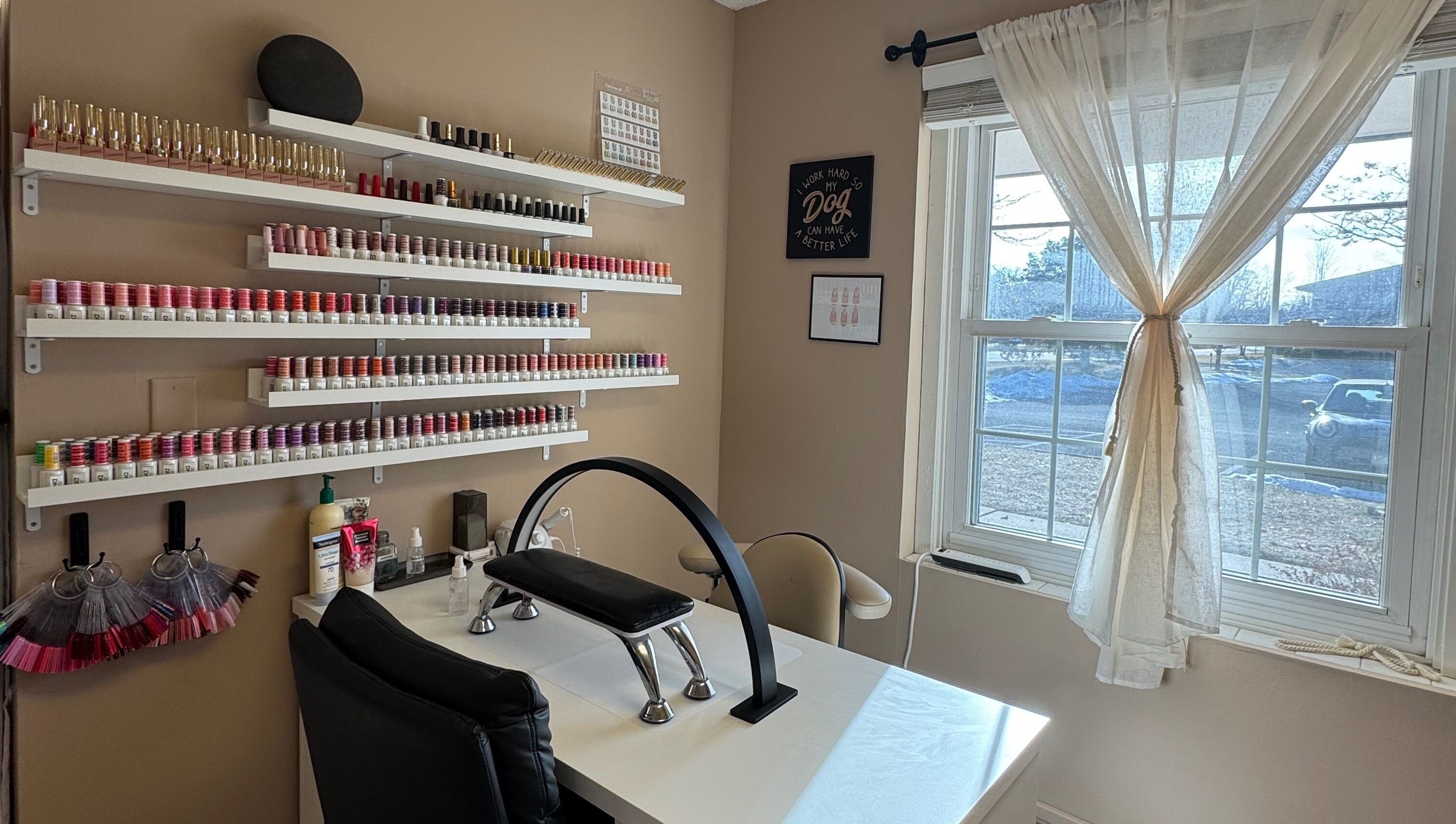 AB Beauty Studio's inviting nail station with colorful polish in Wayzata, Minnesota, US.