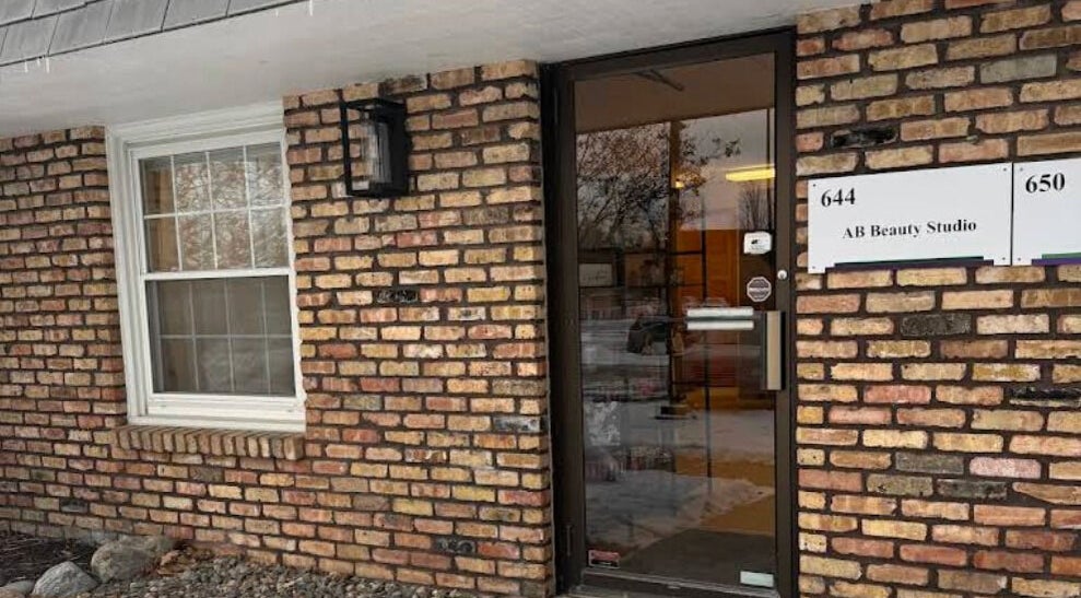 Entrance of AB Beauty Studio with brick facade in Wayzata, Minnesota, US.