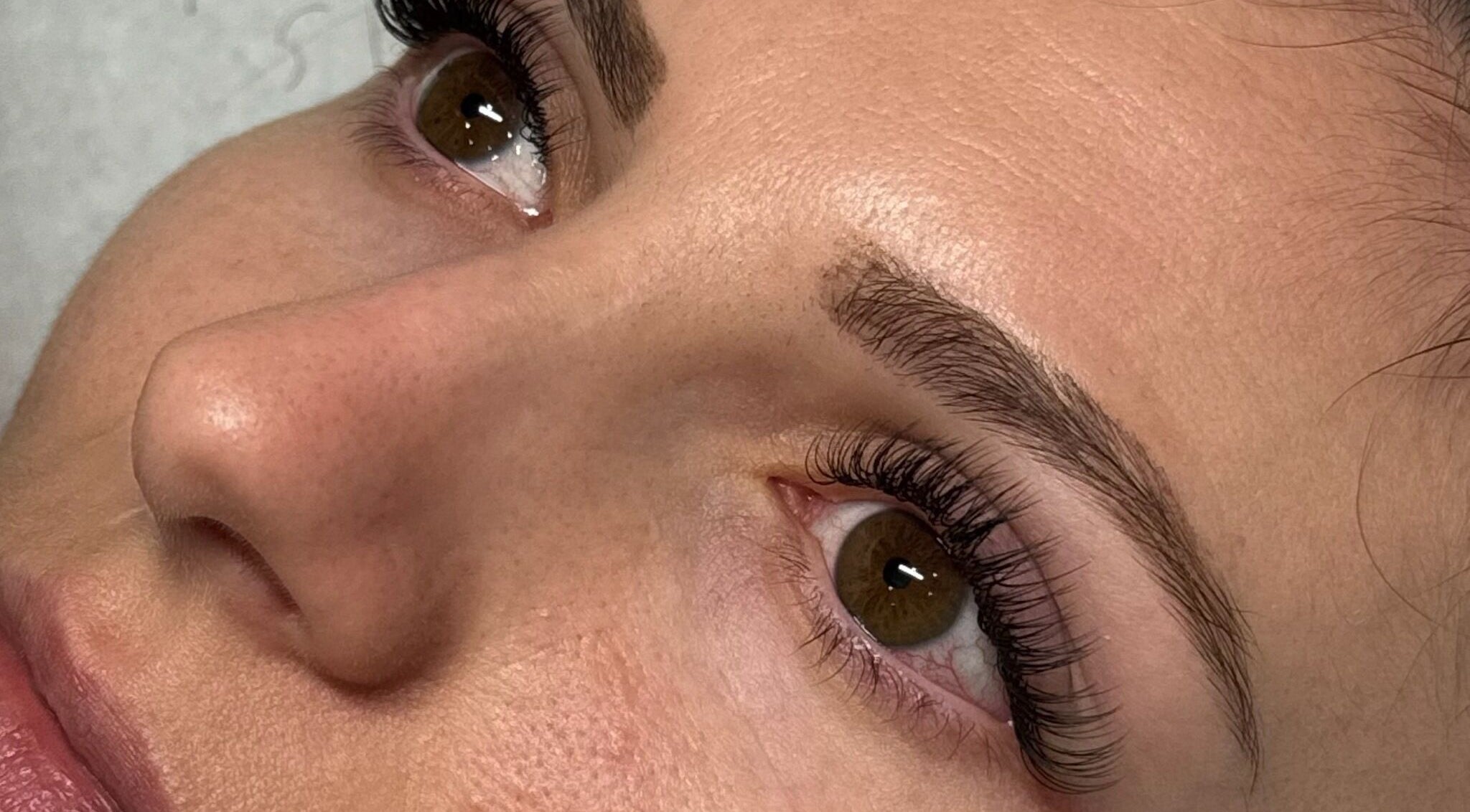 Close-up of eyelash extensions at Beautique Hair and Beauty Bar, Haywards Heath, GB. Showcasing detailed lash work.