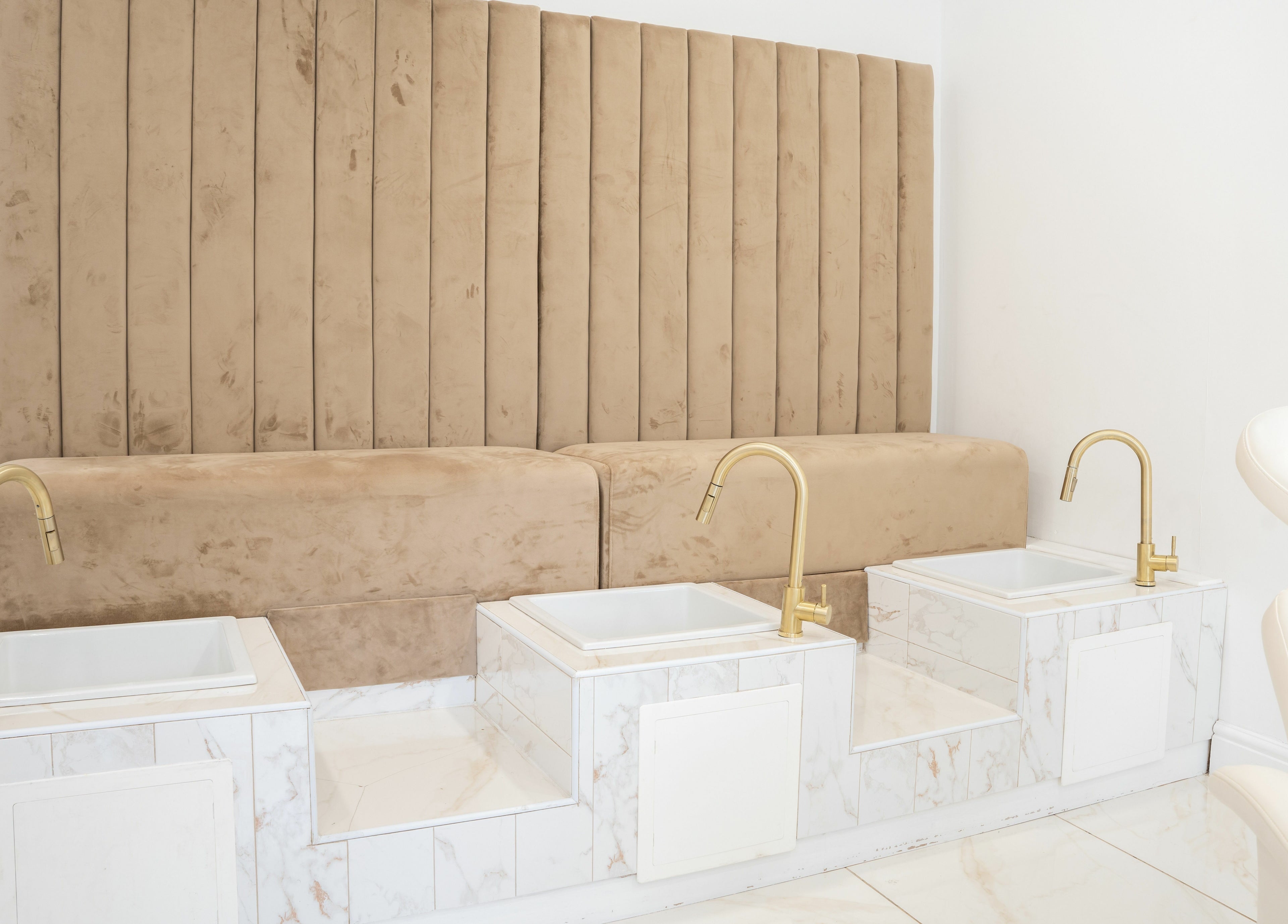 Stylish pedicure stations with plush seats at Lashes by Nadia in Chessington, England, GB.