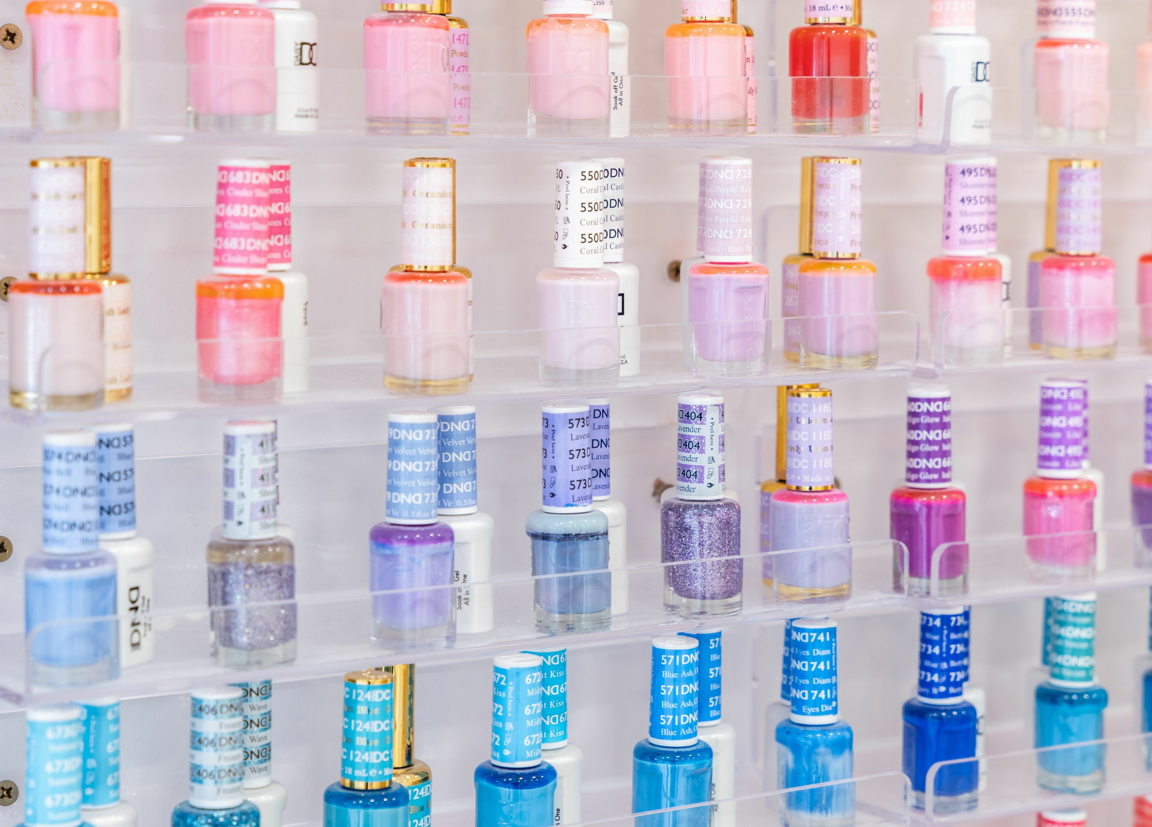 Vibrant nail polish collection at Lashes by Nadia, Chessington, England, GB showcasing diverse hues.