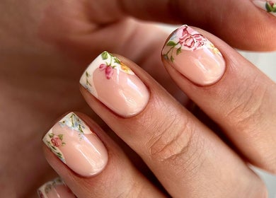 Intricate floral nail art at Chapter1 Salon, Cheltenham, England, GB showcasing elegant manicure designs.