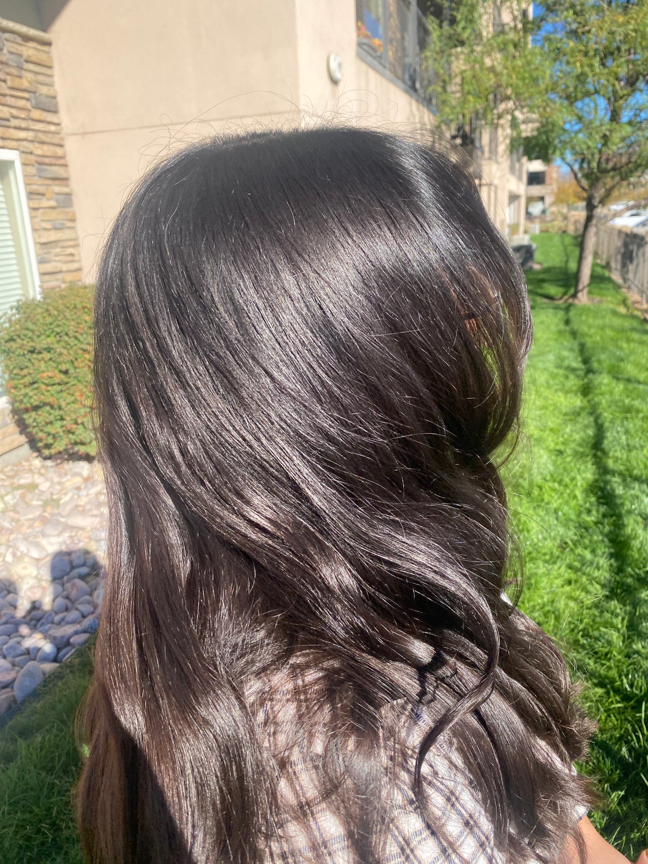 Hair with a sleek, polished finish, showcasing Bailey Tibbitts' expert styling in Centerville, Utah, US.