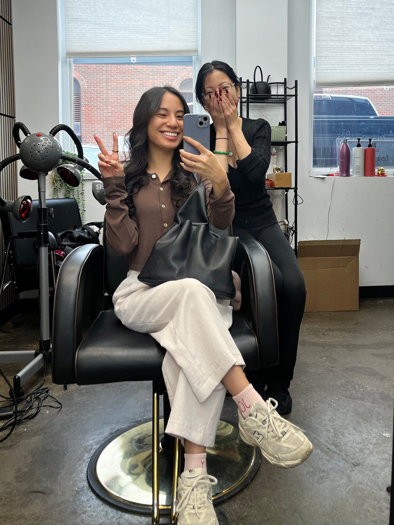 Clients enjoying a relaxing moment in a modern hair salon in Layered by Lisa, Calgary, Alberta, CA